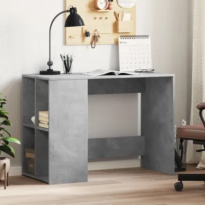 A desk with shelving on the left side, a lamp, books, and a calendar on top.