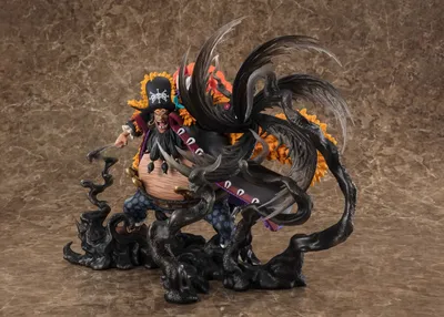 A figurine of a character from One Piece, Marshall D. Teach, also known as Blackbeard, in a dynamic pose with dark, smoky effects.