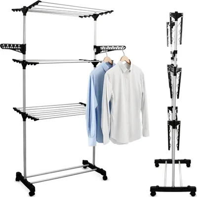 A three-tiered foldable drying rack with clothes hanging on it, shown against a white background.