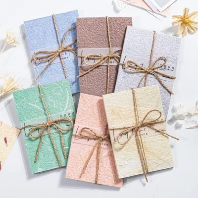 Zdjęcie produktu dla Omgoods - 180 arkuszy papieru w stylu vintage, idealne do kreatywnych projektów