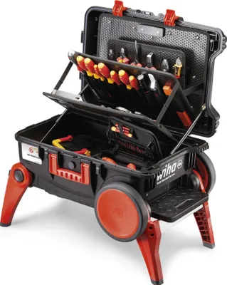 A professional studio shot of an open tool chest on a light gray background.