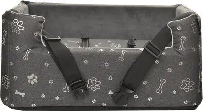 A dog car seat with paw print and bone patterns.
