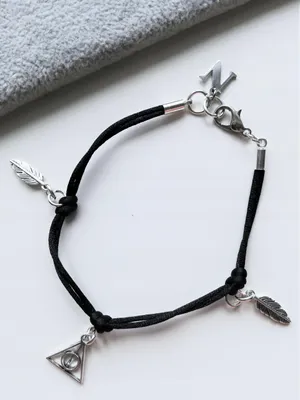 Produktbild von HARRY POTTER BUCHSTABEN-INSIGNIA-Charm-Armband