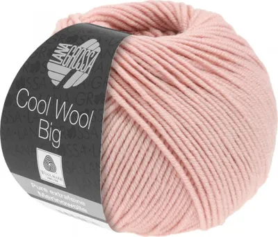 A ball of pink yarn with a label wrapped around it.