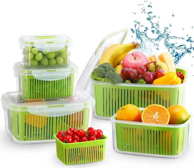 A collection of clear plastic food storage containers with green inserts, filled with various fruits and vegetables, arranged on a white background with water splashes.