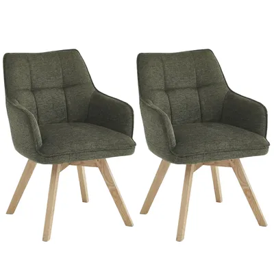 Two green dining chairs with wooden legs against a white background.