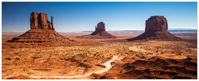 Produktbild von Wallario Wandbild aus Acryl, 125 x 50 cm, freischwebende Optik - Monument Valley unter blauem Himmel