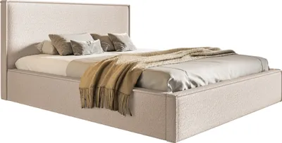 A bed with pillows and a blanket.
