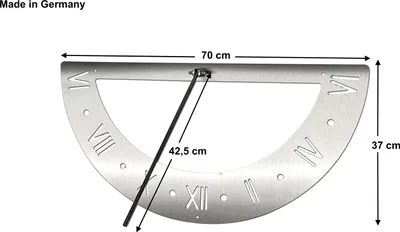 A silver sundial with Roman numerals and dimensions indicated by measurement lines and text.