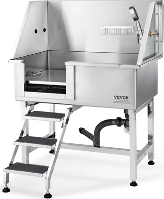 A stainless steel dog grooming tub with attached steps and plumbing.