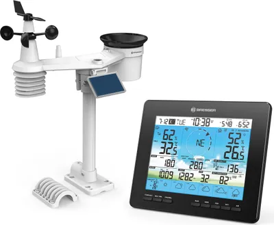A white weather station and a black digital display are shown on a white background.