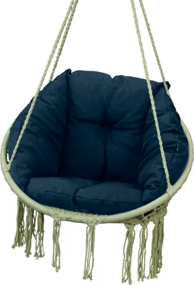 A hanging chair cushion with tassels.