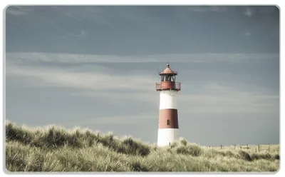 Produktbild von Wallario Frühstücksbrettchen aus Glas, je 14 x 23 cm, mit rutschfesten Füßen, Motiv Leuchtturm auf der Düne am Strand