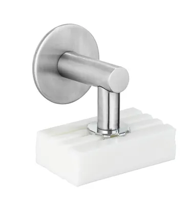 A wall-mounted soap dish with a white soap bar.