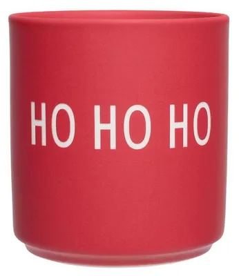 A red mug with white text.
