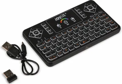 A black wireless keyboard with a touchpad and USB cable and receiver on a white background.
