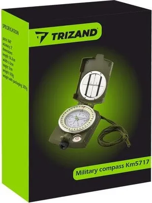 The image shows the retail packaging of a Trizand military compass. The compass itself is visible on the packaging.