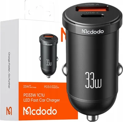 A product shot of a car charger and its packaging.