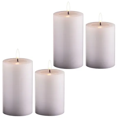Produktbild von 4er Set Led Kerzen flackernde Flamme mit Echtwachspiegel weiß 7,5cm ø 2x 12, 5cm, 2x10 cm Höhe, LED Kerzen mit Timerfunktion, 2 AA Batterien nötig, LED Echtwachs Stumpenkerzen warmweiß