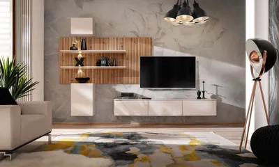 A modern living room with a wall-mounted entertainment unit, TV, and decorative items.