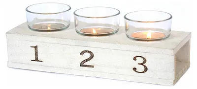 Immagine prodotto di Candeliere in legno bianco con 3 portacandele, dimensioni 24 x 8,5 cm, altezza da 5 a 8 cm