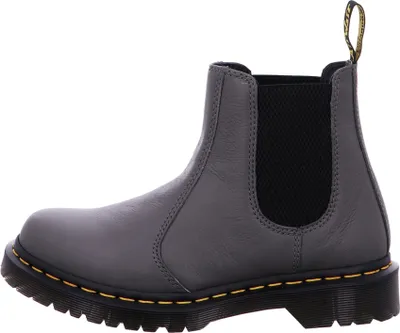 A side view of a single Dr. Martens Chelsea boot against a white background.