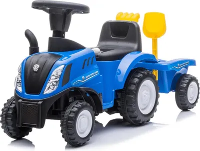 A blue toy tractor with a trailer, shovel, and rake, shown from a three-quarter front view against a white background.