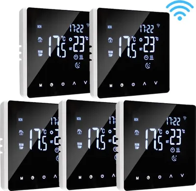 A group of five smart thermostats arranged in a grid.