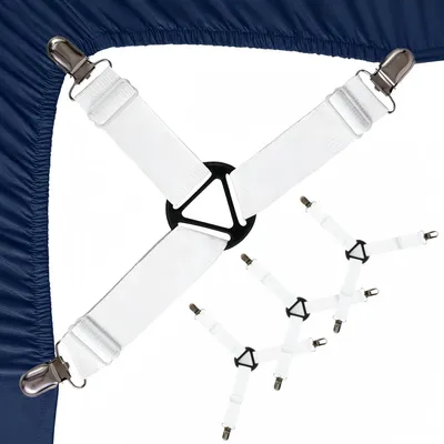 Immagine prodotto di 4 fermalenzuolo regolabili, a forma triangolare, bianchi, con clip in metallo