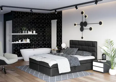 A modern bedroom with an integrated bathroom area.