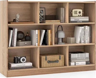 A wooden bookshelf filled with books and decorative items.