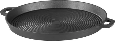 A cast iron grill pan with concentric ridges on a white background.