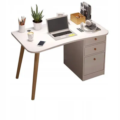 A white computer desk with wooden legs and a set of drawers on the right side, featuring a laptop, a plant, a mug, and a smartphone.