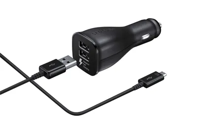 A black Samsung car charger with two USB ports and a USB-C cable plugged into one of the ports.