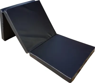 A folded black mattress lying on a white background.
