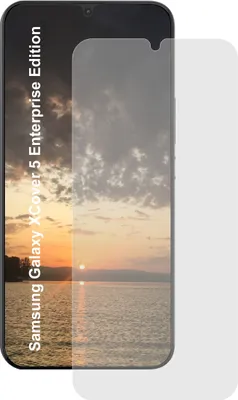 A screen protector is placed over a smartphone displaying a sunset.