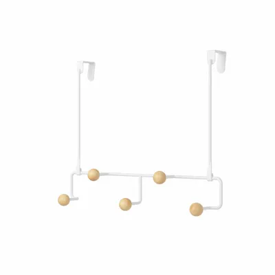 A white over-the-door coat rack with five wooden knobs.