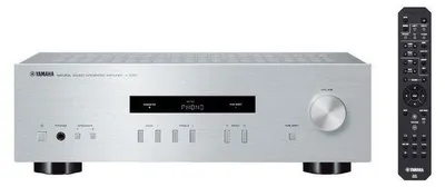 A silver Yamaha stereo amplifier and a black remote control are shown against a white background.