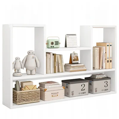 A white shelf unit displaying various decorative items and storage boxes.