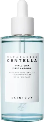 A product shot of a skincare ampoule bottle with a dropper.