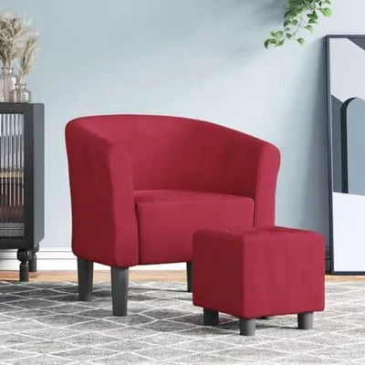 Immagine prodotto di Poltrona elegante per il soggiorno, realizzata in morbido tessuto di velluto, con braccioli imbottiti, poggiapiedi e struttura robusta, disponibile nel colore bordeaux