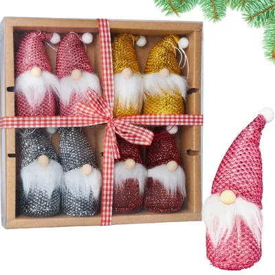 A set of eight Christmas gnomes in a gift box, with one gnome placed outside the box.
