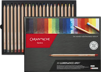 A box of Caran d'Ache Luminance colored pencils, with a display of the colors and the pencils themselves.