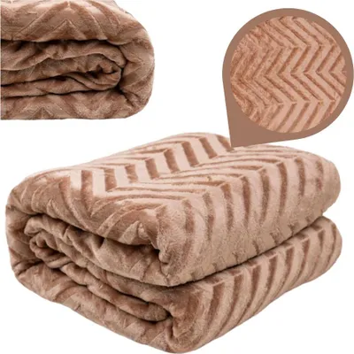 A folded brown blanket with a chevron pattern is shown against a white background.