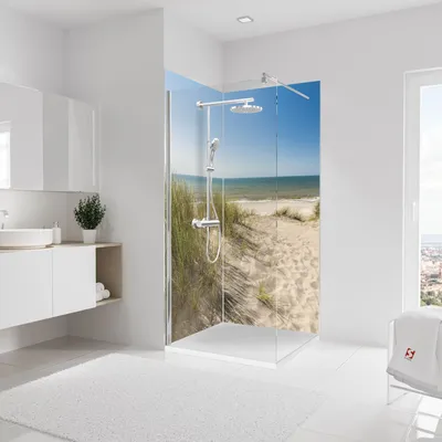 A modern bathroom with a walk-in shower featuring a scenic beach mural.