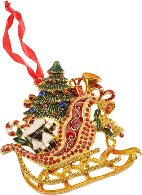 A Christmas ornament in the shape of a sleigh filled with holiday items.