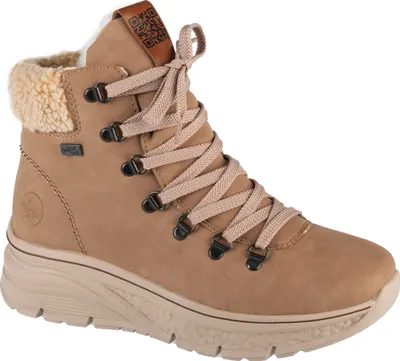 A single beige boot with a fluffy lining and laces.
