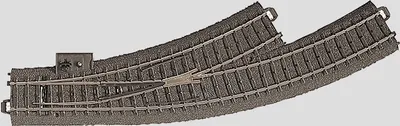 A model railway track switch (Bogenweiche) with a mechanism for changing the track direction.