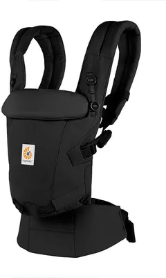 A black Ergobaby baby carrier is shown against a white background.