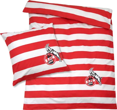 A bedding set with red and white stripes and a team logo.